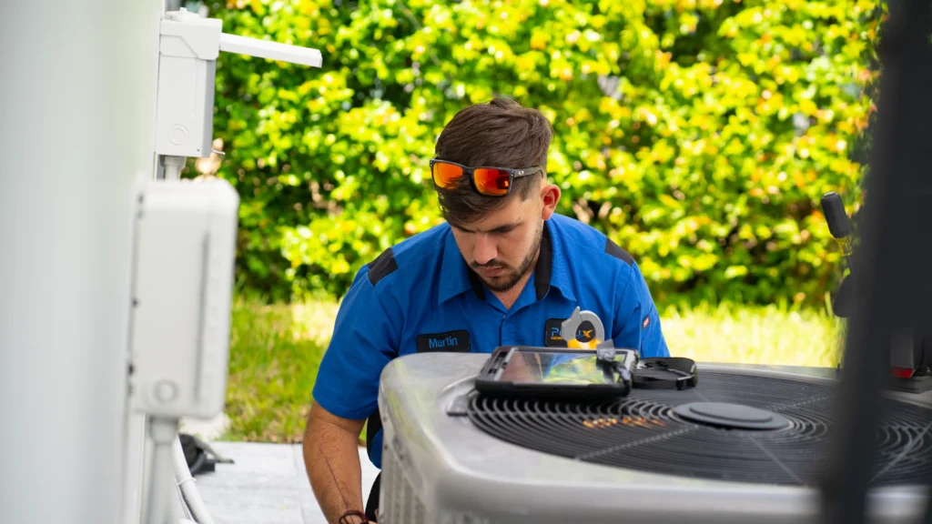 pollux air hvac specialist fixing air conditioning unit